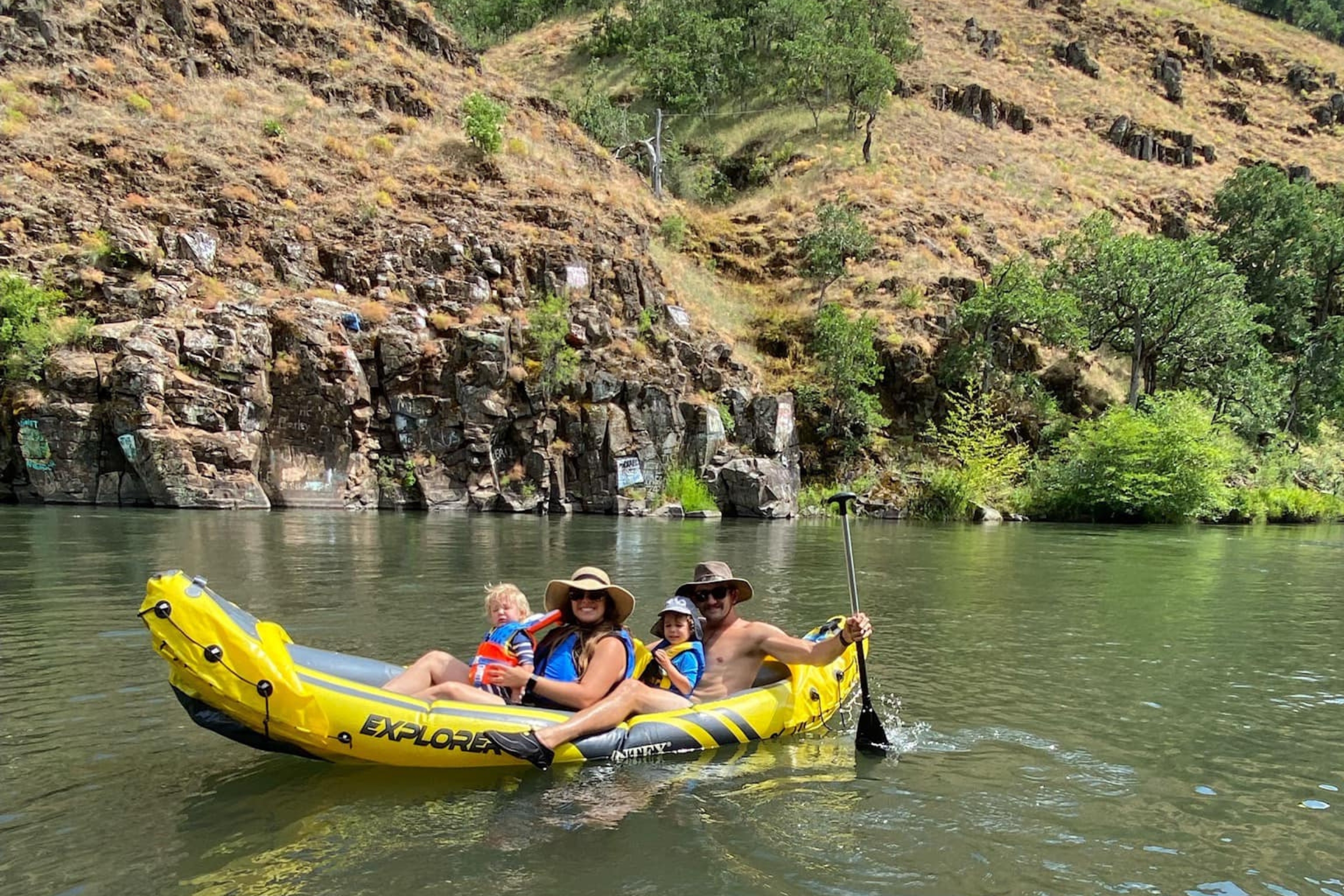 A group of people in a canoe on the water.