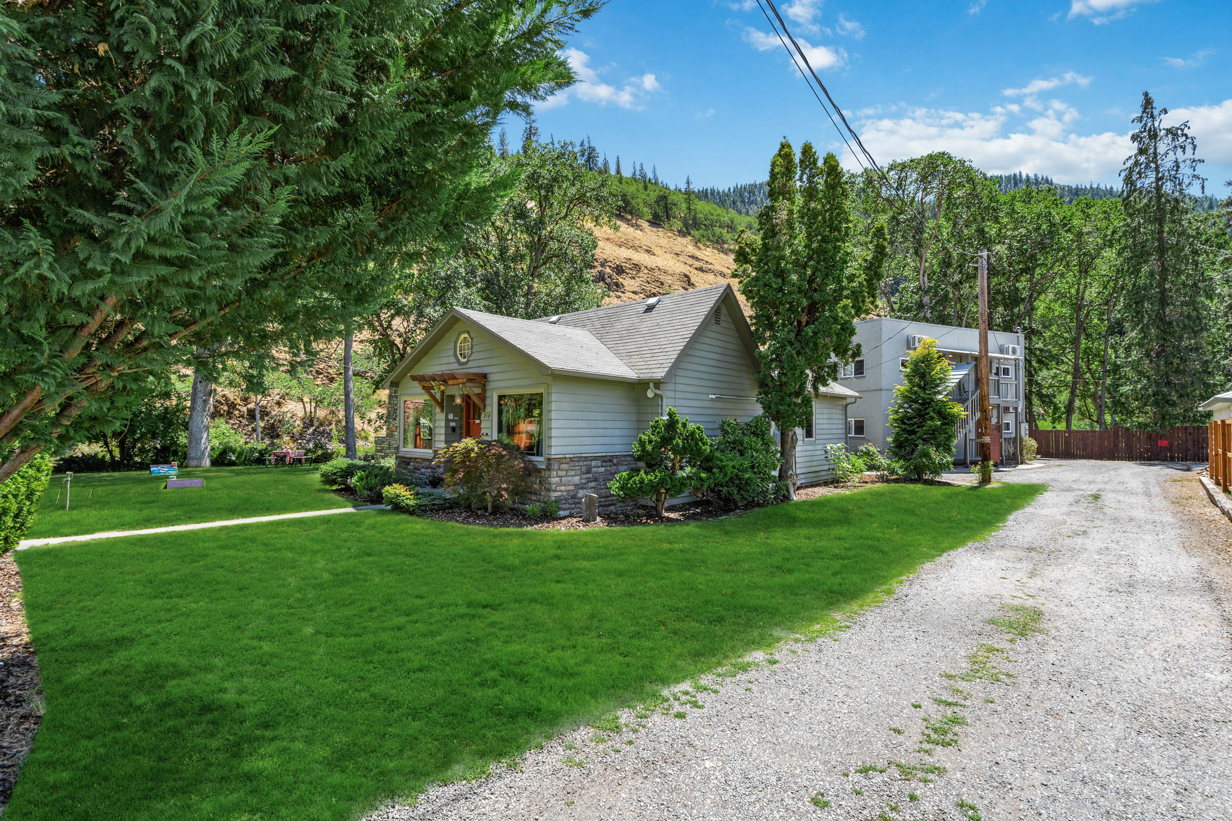 A house with a lot of grass on the ground